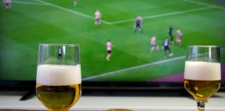 Honesty is the best policy Glasses of beer and football match in background