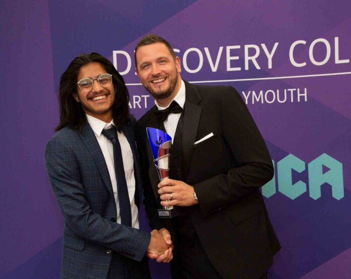 YMCA-student-Rehman-left-reciving-studentofyearawa-tom-lavis-ceo-right YMCA-student-Rehman-left-reciving-studentofyearawa-tom-lavis-ceo-right