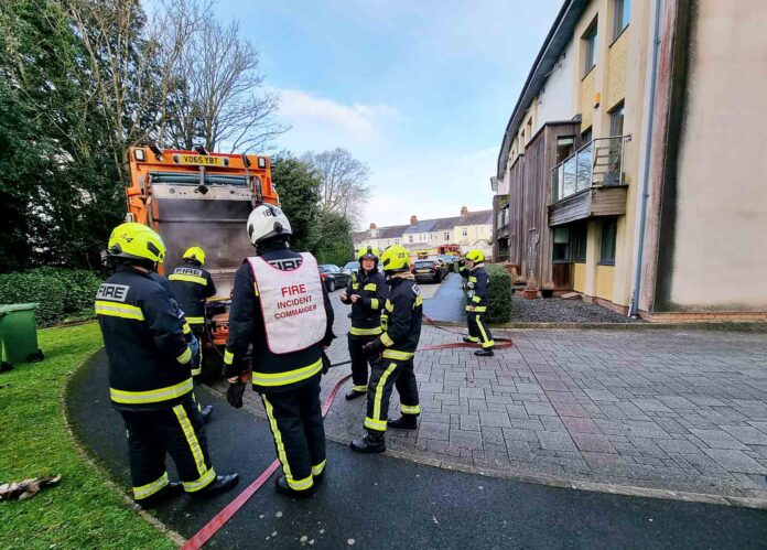 Firefighters tackle the blaze in the refuse truck Firefighters tackle the blaze in the refuse truck