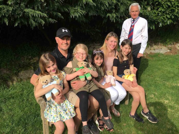 Rosie-1 Rosie pictured with her mother and father Andrew and Sarah, sisters Holly, Jasmine and Berry and John Pritchard