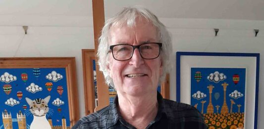 Artist Brian Pollard with the painting competition prize