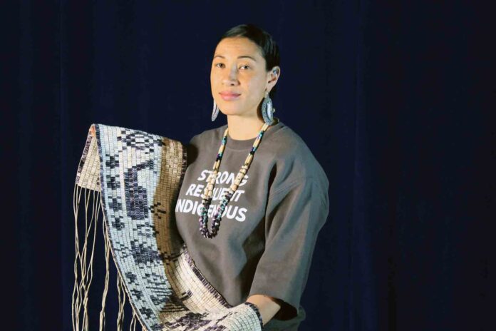 Danielle Hill with the new wampum belt Danielle Hill with the new wampum belt