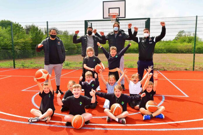 Pupils from Sherford Vale pictured with members of the Plymouth Raiders basketball team Pupils from Sherford Vale pictured with members of the Plymouth Raiders basketball team