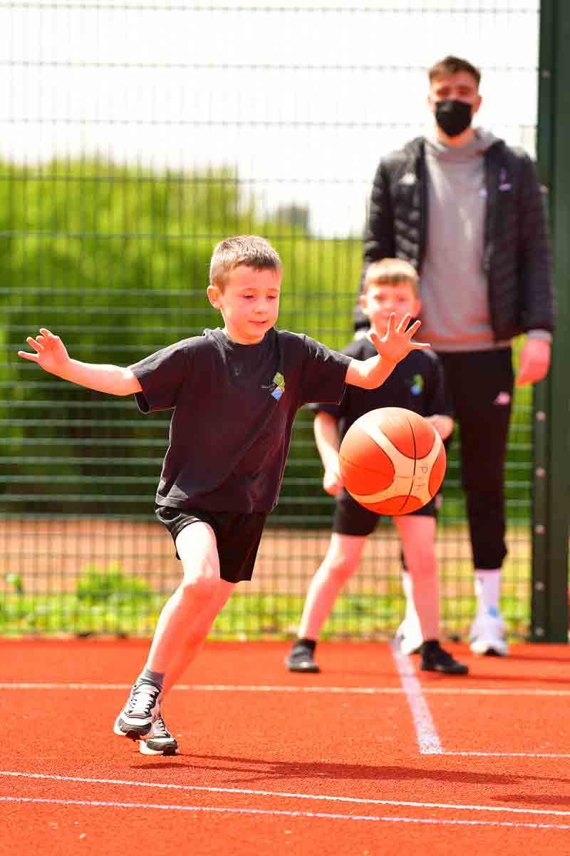 Boy playing basketball at Sherford Vale