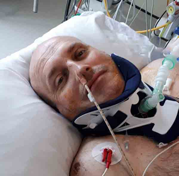 Mike in the hospital bed at Derriford