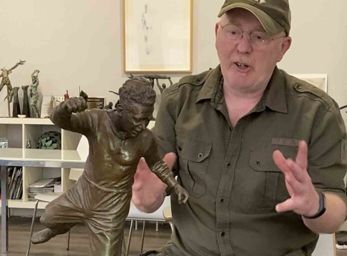 Sculptor Andy Edwards with an impression of what the statue will look like Sculptor Andy Edwards with an impression of what the statue will look like