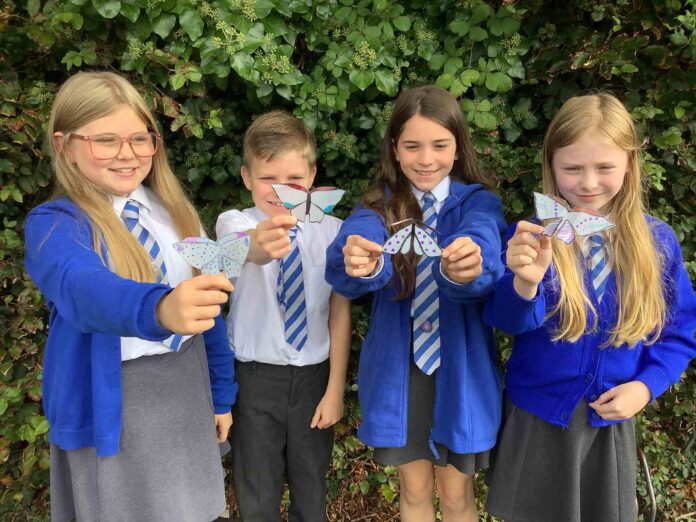 Children from Eggbuckland Vale Primary School with their moths Children from Eggbuckland Vale Primary School with their moths