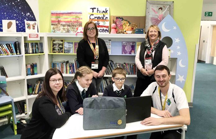 Laptops donated to Sherford Vale School during the pandemic in 2020. Pictured are Rotarian Jo and President Sam with headteacher Carla Laptops donated to Sherford Vale School during the pandemic in 2020. Pictured are Rotarian Jo and President Sam with headteacher Carla