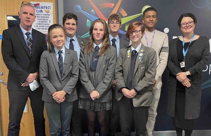 Martin Brook, Lipson Academy headteacher, left, with students from Lipson Academy, and Moira Marder, chief executive of the Ted Wragg Trust, right Lipson Academy pupils with Moira Marder, chief executive of the Ted Wragg Trust