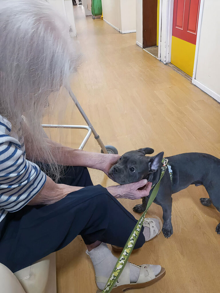 Dudley with resident Beth Gray