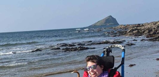 Grace Butland...loves the beach wheelchair