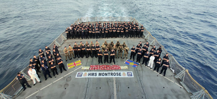Team HMS Montrose show off their drugs haul on the frigate’s flight deck Team HMS Montrose