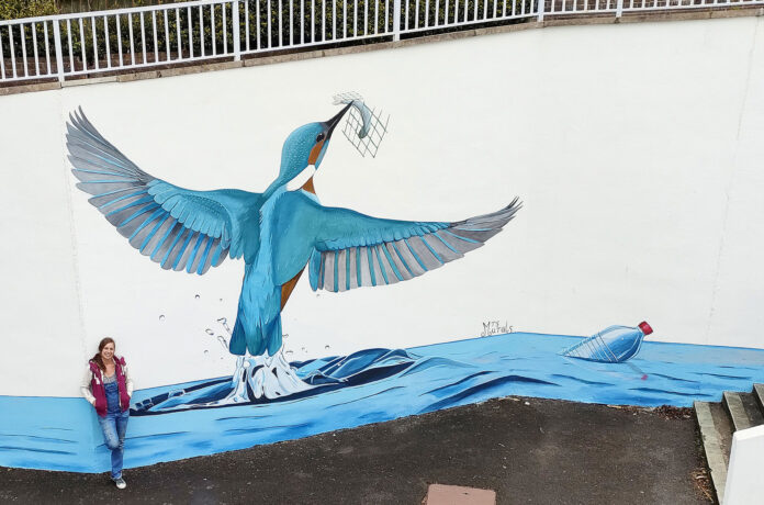 Local artist Ellie Johnson - better known as Mrs Murals – with her stunning kingfisher painting Local artist Ellie Johnson - better known as Mrs Murals – with her stunning kingfisher painting