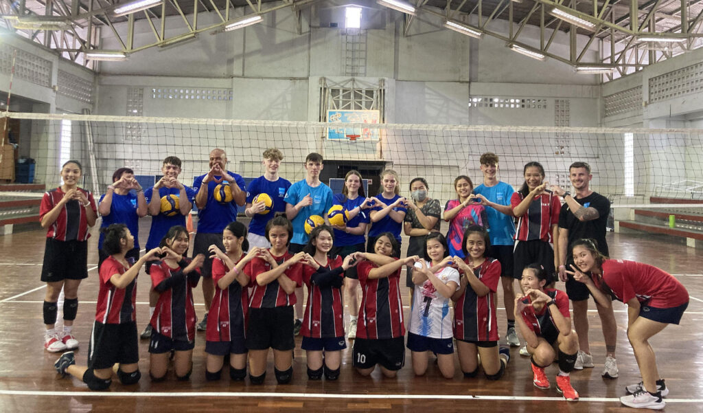 City College students pictured with their hosts in Thailand