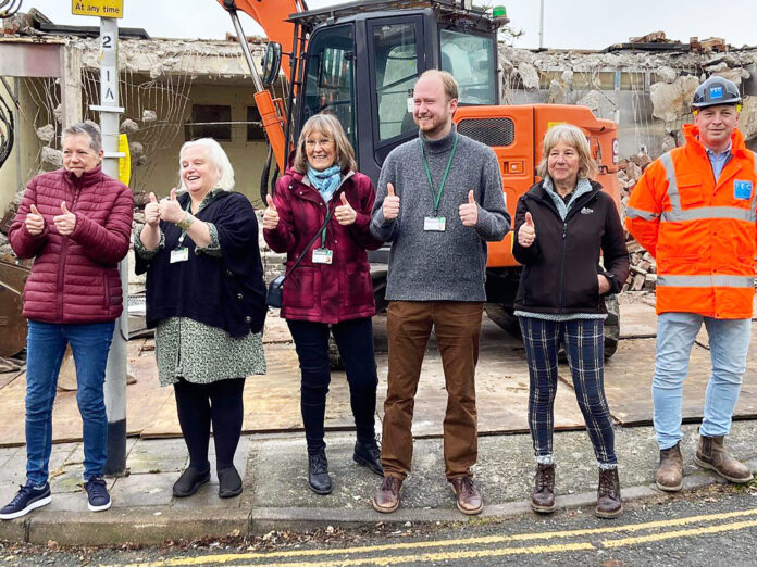Stoke Village square Councillors, local residents and one of the contractors celebrate the demolition