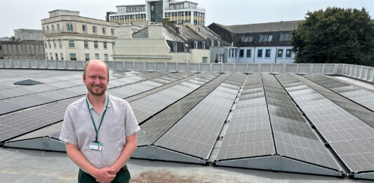 Councillor Tom Briars-Delve pictured with the solar panels on top of the Theatre Royal car park
