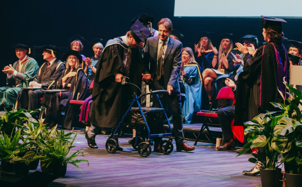 Ezra on stage with his father Malcolm in Theatre Royal Plymouth