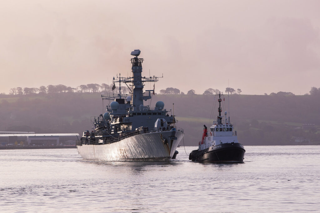 Pictured: HMS Portland arrives back home in Plymouth after months away on operations. The Devonport based Type 23 frigate HMS Portland, has arrive back at her base port in Plymouth having returned from a busy period patrolling in UK water and across the North Atlantic. The Ship was welcomed by friends and families on the Jetty after sailing the final few miles from Plymouth Sound up the River Tamar. Her deployment in the North Atlantic also included a stop off in Halifax, Nova Scotia on Canada’s Eastern Seaboard, where she attended the first International Sea Week held at the newly refurbished Halifax Naval Base. During the visit the Ship’s Rugby team played a game against a North Atlantic select. HMS Portland also joined the HMS Queen Elizabeth Carrier Strike group and operated with other NATO partners.