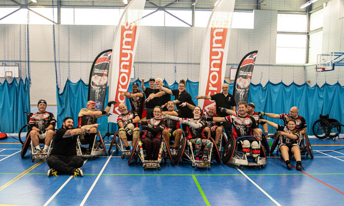 Boost for wheelchair rugby club Members of the Team Endeavour Wheelchair Rugby Club celebrating the Morrisons donation.