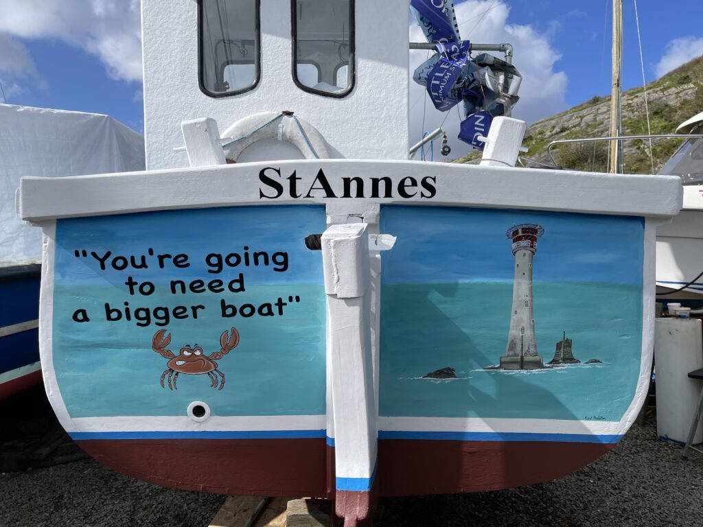 Kevin Preston on the completion of the final touches on the extensive boat mural including sign writing