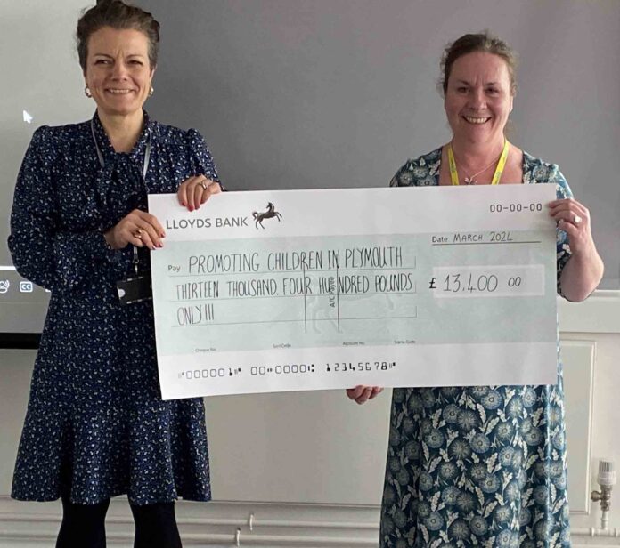 Law firm's cheque for charity
