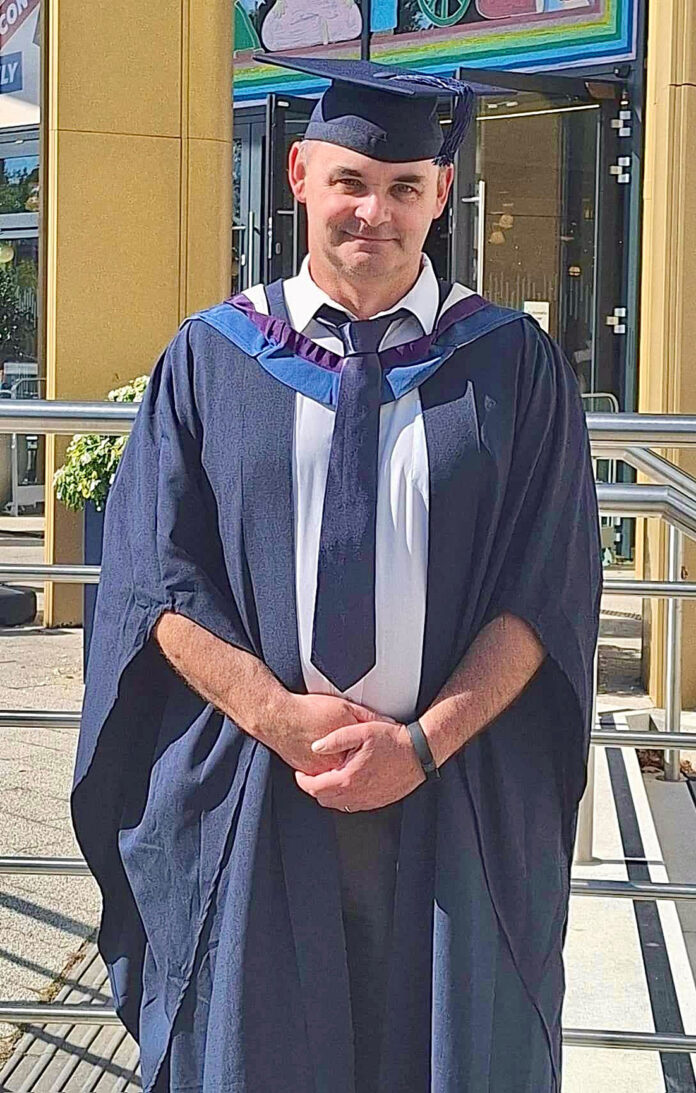 Mark Ackrell diploma graduation 2