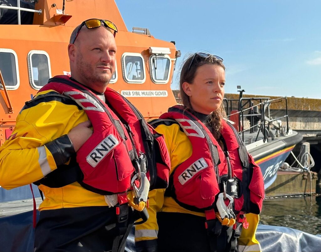 Static photo of two members of Plymouth RNLI team